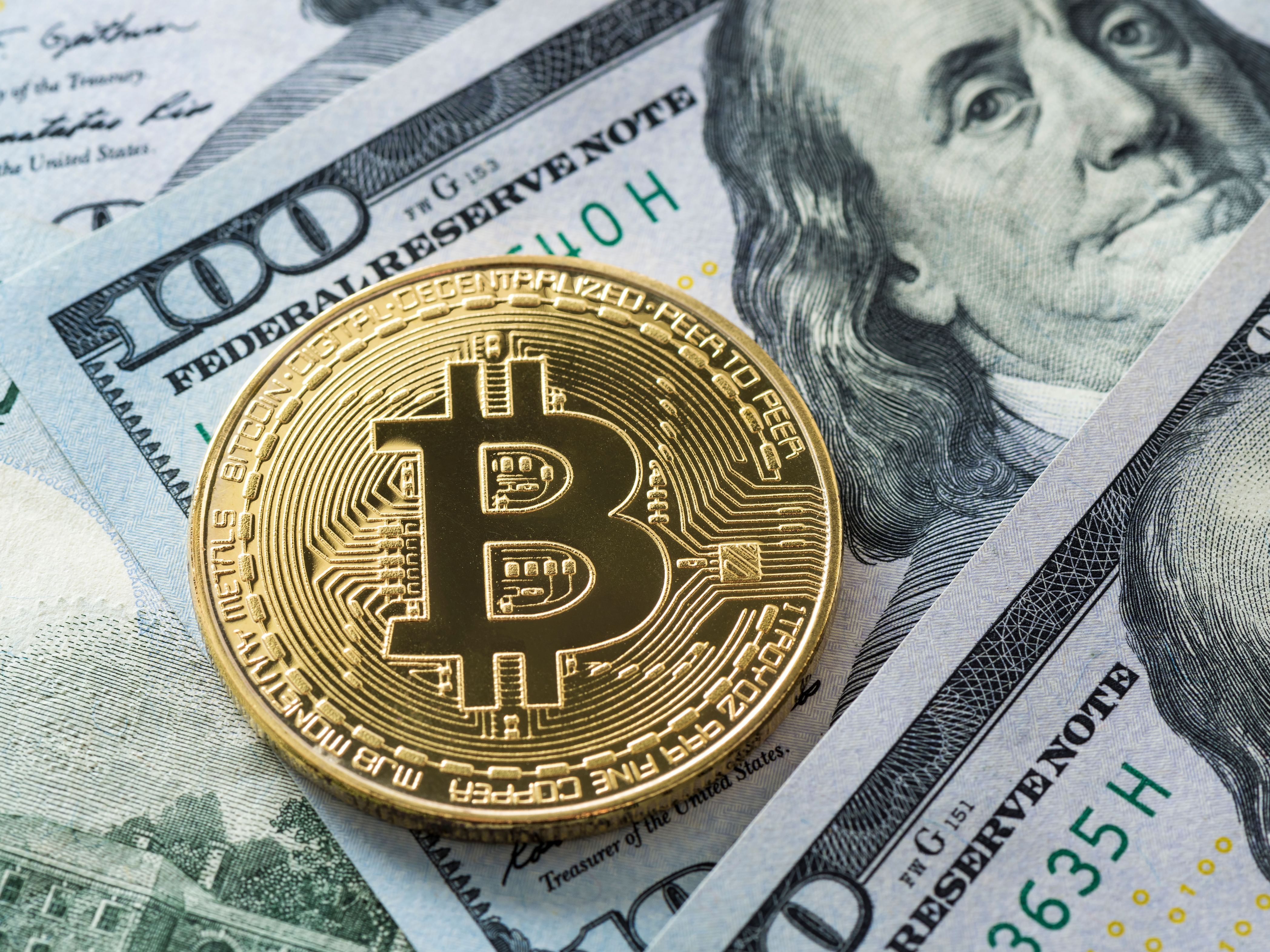 Dollar pulls back; bitcoin, ether gain
